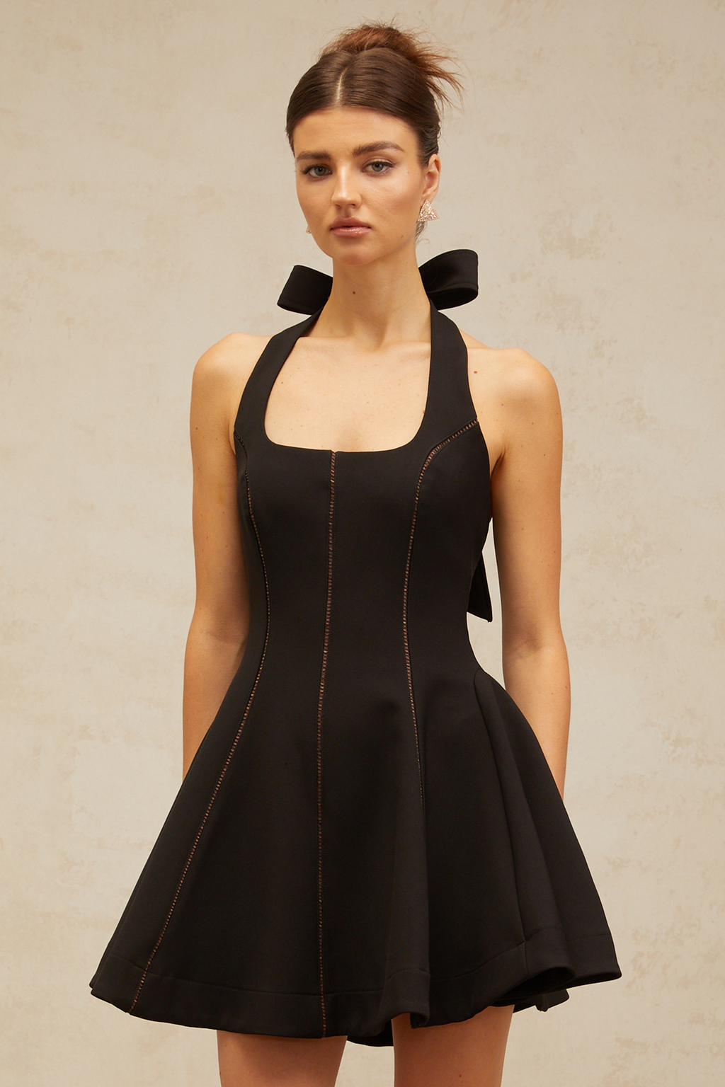 sandy halterneck bow-embellished mini dress in Black