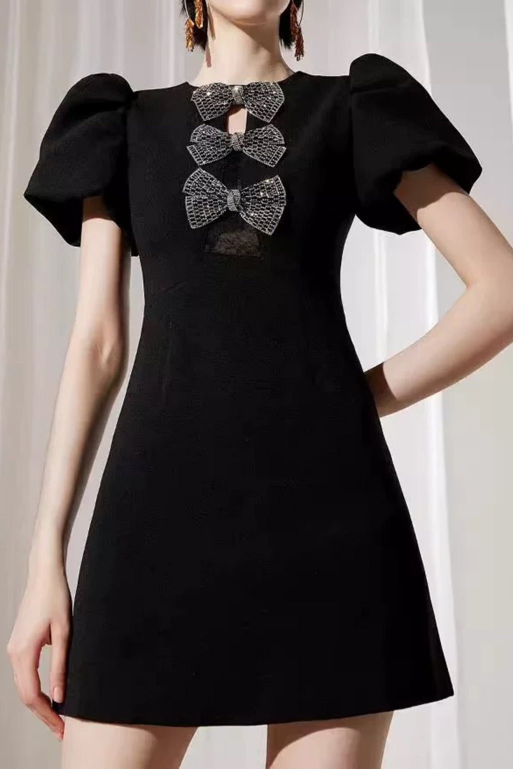 vanessa bow puff sleeve mini dress in black