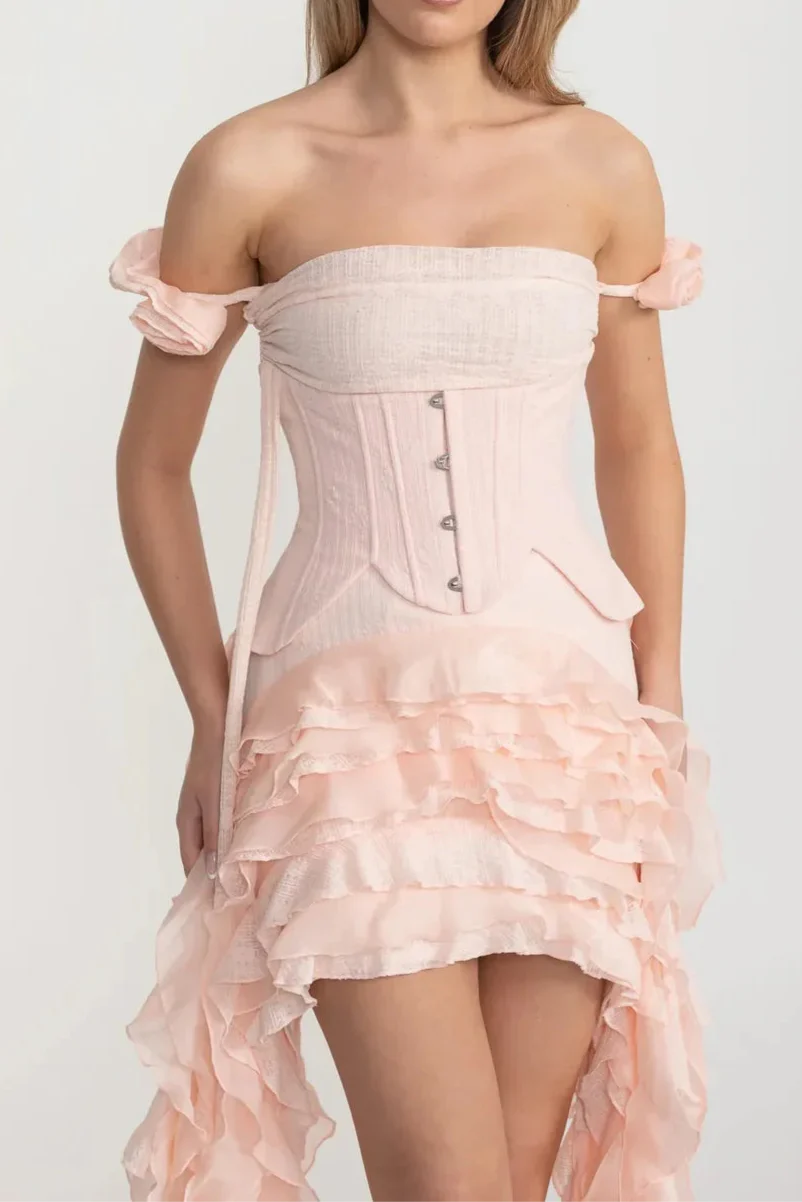 Vintage Inspired Corset Dress With Ruched Bustier And Flowing Ruffled Side Details - Pink